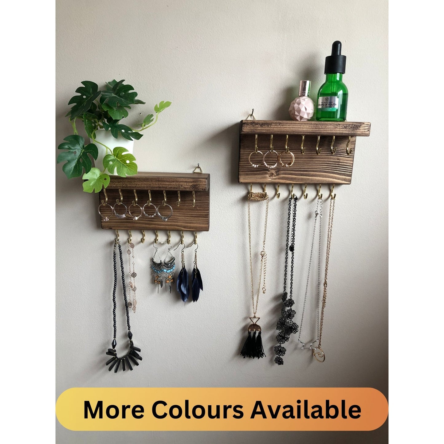 Each organizer, measuring 16cm in length, provides compact storage adaptable to any wall space, boasting a total of 28 hooks for ample room to elegantly display your favorite pieces. Featuring convenient D rings for easy hanging, these organizers double as additional shelving, perfect for storing smaller accessories. Handcrafted from carefully selected timber, each piece exudes natural charm with unique grain patterns, available in enchanting colors like Woodland, Rustic Oak, and Ebony.