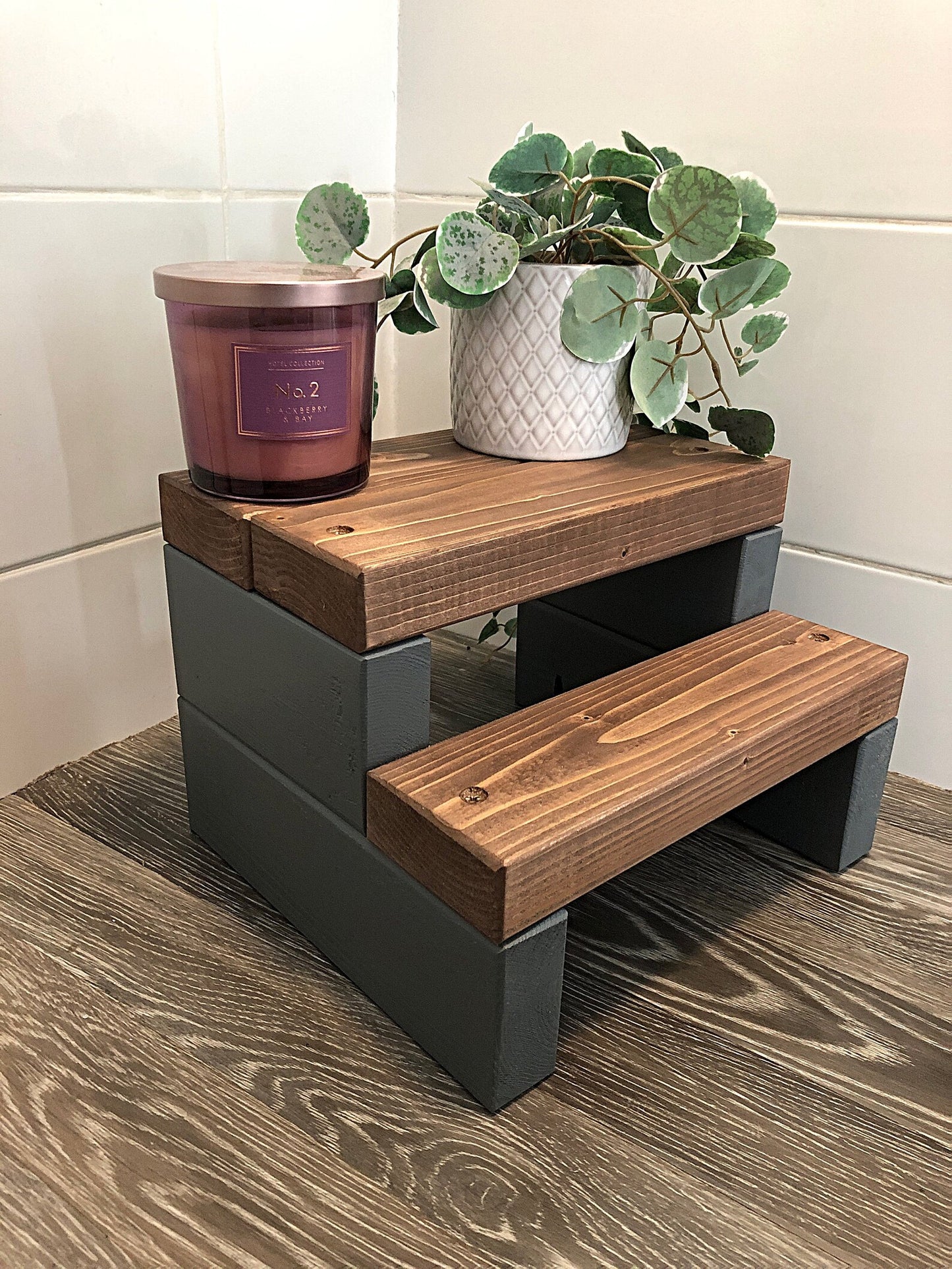 Handmade 2-tier wooden step stool, ideal for reaching high places in any room. Crafted from Scandinavian Pine with a two-tone finish. Base available in select Farrow and Ball colors. Dimensions: W: 30cm, H: 21cm, D: 26cm. Other colour options include Fresh Pine. Variations in grain and colour may occur due to the unique nature of each piece of wood