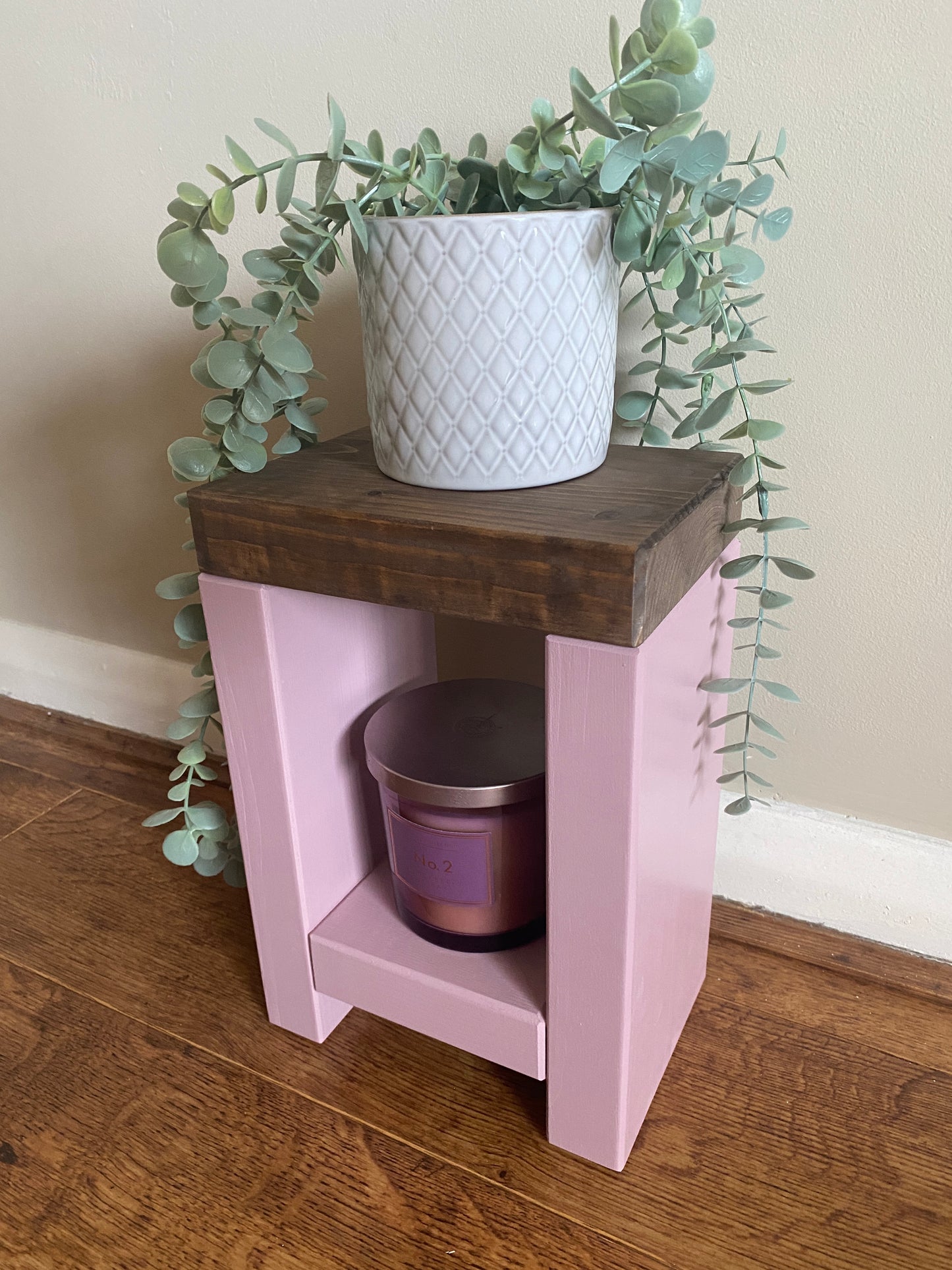 Artisan-crafted from premium timber, this small side table exudes character and elegance with its hand-applied finish in Farrow and Ball colors. Perfect for adding a bespoke touch to your decor, its carefully chosen hues enhance the table's natural beauty while seamlessly blending with any interior style. Elevate your space with this unique piece of furniture, meticulously crafted to bring warmth and sophistication to your home