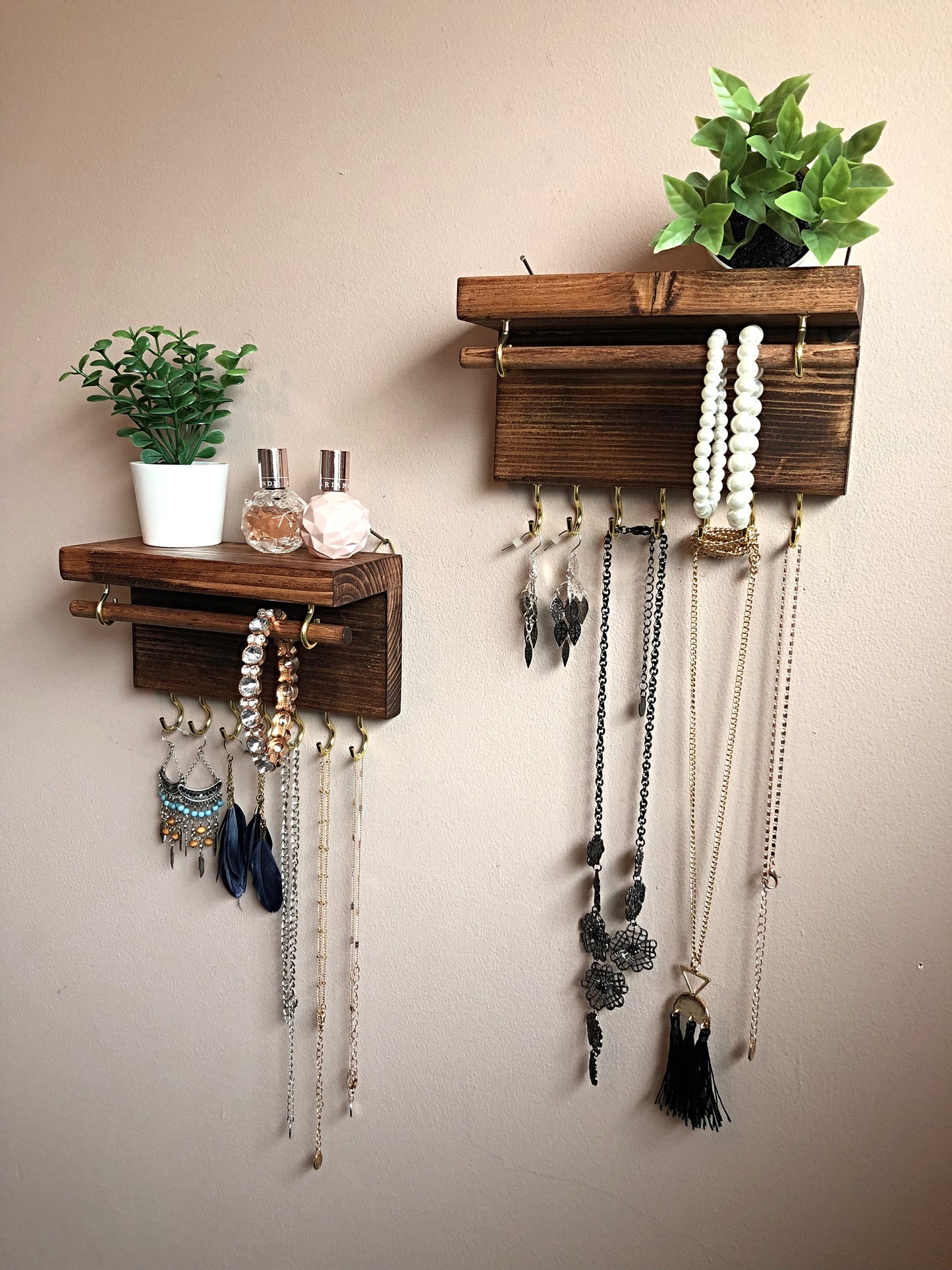 Handmade wooden jewellery organizers and earring displays in various finishes including Rustic Oak and Ebony. Each organizer features 7 brass hooks for ample storage. Perfect for showcasing necklaces, bracelets, and earrings. Customize with brass or upgrade to silver/chrome hooks and D rings