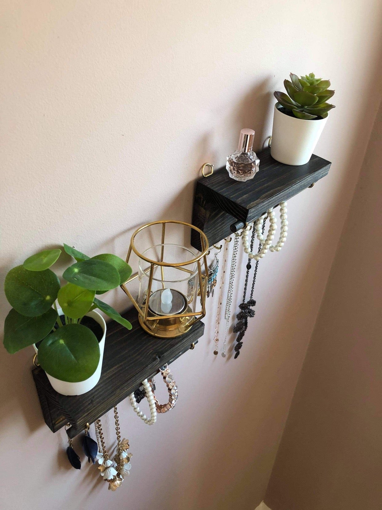 Handmade wooden jewellery organizers and earring displays in various finishes including Rustic Oak and Ebony. Each organizer features 7 brass hooks for ample storage. Perfect for showcasing necklaces, bracelets, and earrings. Customize with brass or upgrade to silver/chrome hooks and D rings