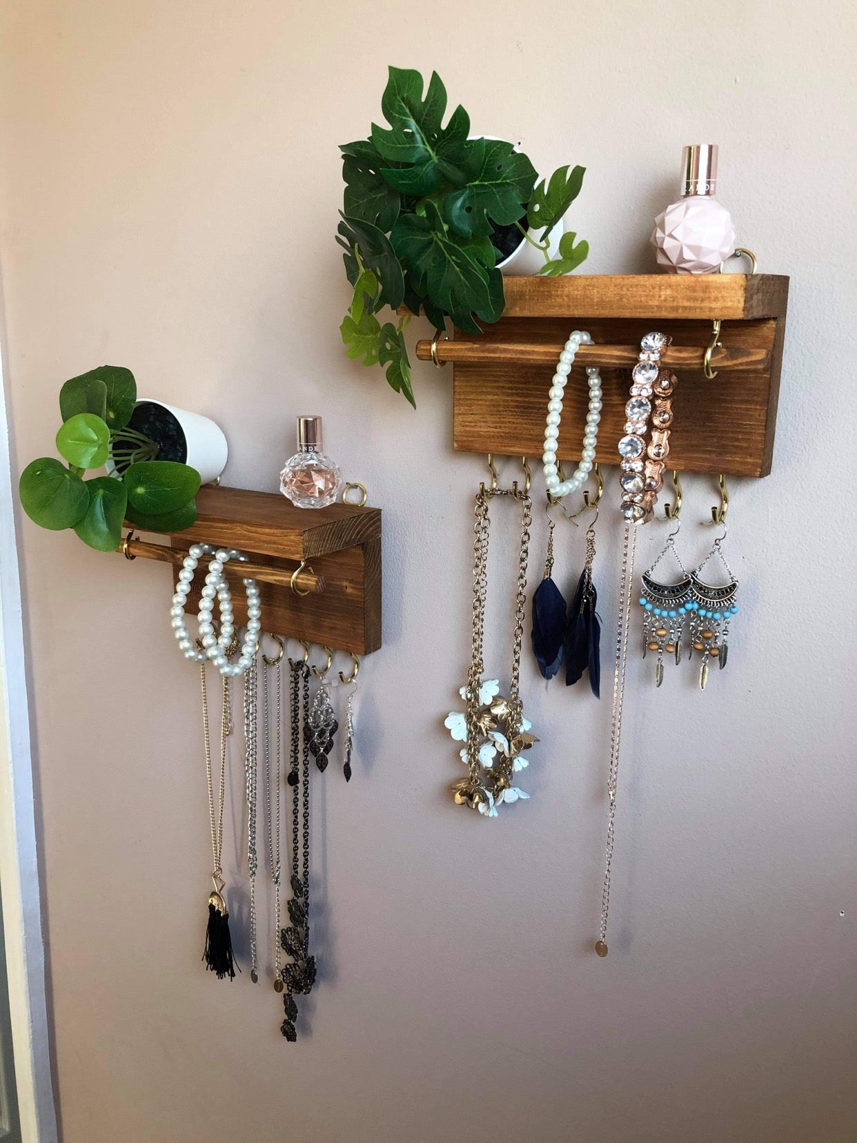 Handmade wooden jewellery organizers and earring displays in various finishes including Rustic Oak and Ebony. Each organizer features 7 brass hooks for ample storage. Perfect for showcasing necklaces, bracelets, and earrings. Customize with brass or upgrade to silver/chrome hooks and D rings