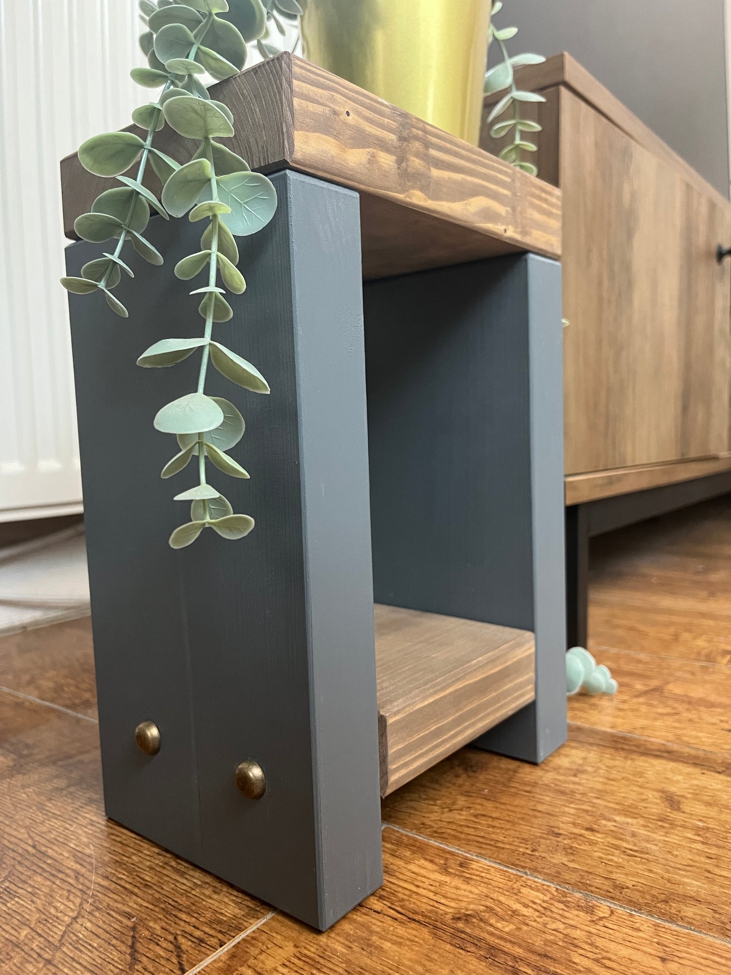 Handmade Mini Side Table crafted from handpicked timber, ideal for cozy corners or snug living areas. Features a top surface for showcasing plants or candles and a low shelf for clutter-free storage. Handmade to order with a durable finish. Customizable with two-tone effect and Farrow and Ball colors. Dimensions: H: 29.5cm, W: 20cm, D: 14cm, Height between shelf and top: 18cm