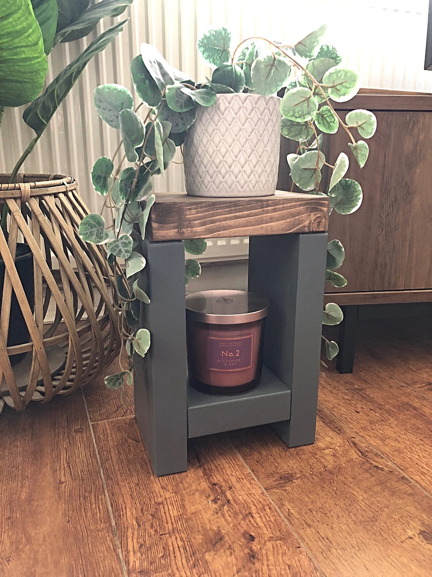Artisan-crafted from premium timber, this small side table exudes character and elegance with its hand-applied finish in Farrow and Ball colors. Perfect for adding a bespoke touch to your decor, its carefully chosen hues enhance the table's natural beauty while seamlessly blending with any interior style. Elevate your space with this unique piece of furniture, meticulously crafted to bring warmth and sophistication to your home