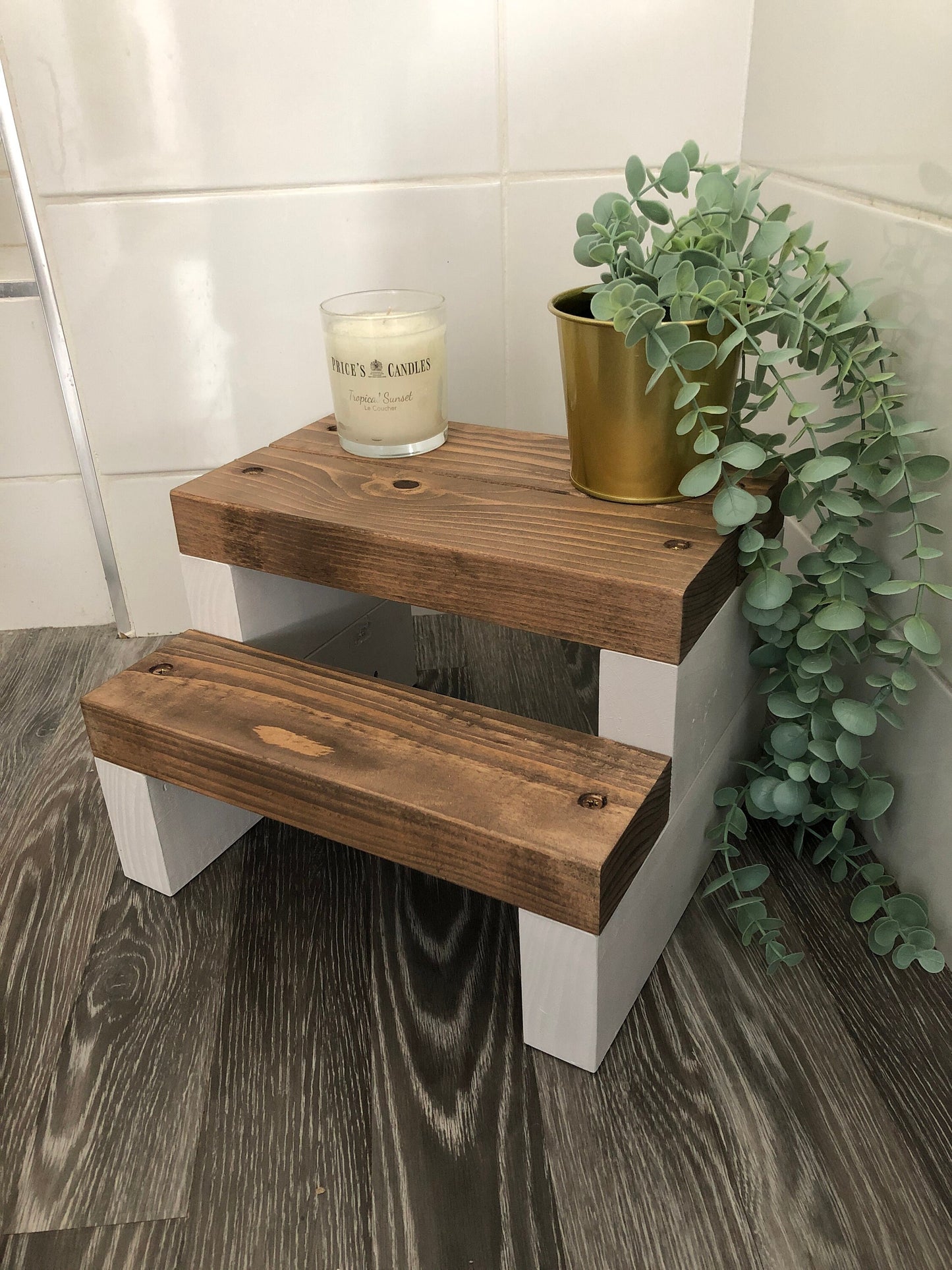 Handmade 2-tier wooden step stool, ideal for reaching high places in any room. Crafted from Scandinavian Pine with a two-tone finish. Base available in select Farrow and Ball colors. Dimensions: W: 30cm, H: 21cm, D: 26cm. Other colour options include Fresh Pine. Variations in grain and colour may occur due to the unique nature of each piece of wood