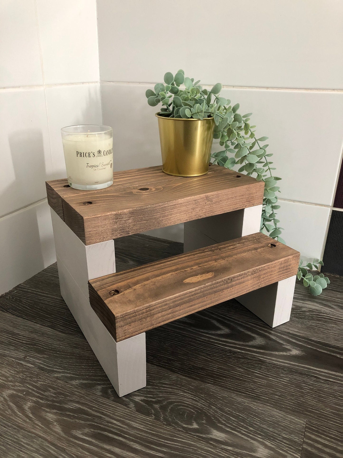 Handmade 2-tier wooden step stool, ideal for reaching high places in any room. Crafted from Scandinavian Pine with a two-tone finish. Base available in select Farrow and Ball colors. Dimensions: W: 30cm, H: 21cm, D: 26cm. Other colour options include Fresh Pine. Variations in grain and colour may occur due to the unique nature of each piece of wood