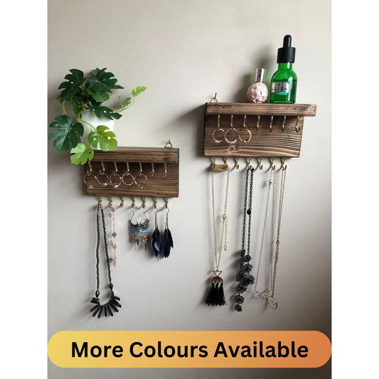 Each organizer, measuring 16cm in length, provides compact storage adaptable to any wall space, boasting a total of 28 hooks for ample room to elegantly display your favorite pieces. Featuring convenient D rings for easy hanging, these organizers double as additional shelving, perfect for storing smaller accessories. Handcrafted from carefully selected timber, each piece exudes natural charm with unique grain patterns, available in enchanting colors like Woodland, Rustic Oak, and Ebony. 