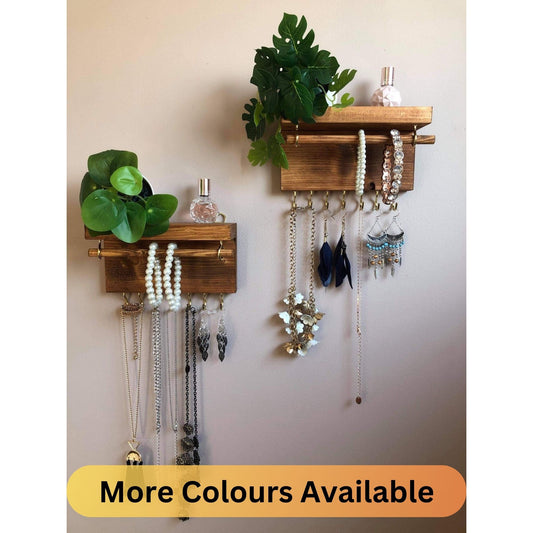 Handmade wooden jewellery organizers and earring displays in various finishes including Rustic Oak and Ebony. Each organizer features 7 brass hooks for ample storage. Perfect for showcasing necklaces, bracelets, and earrings. Customize with brass or upgrade to silver/chrome hooks and D rings