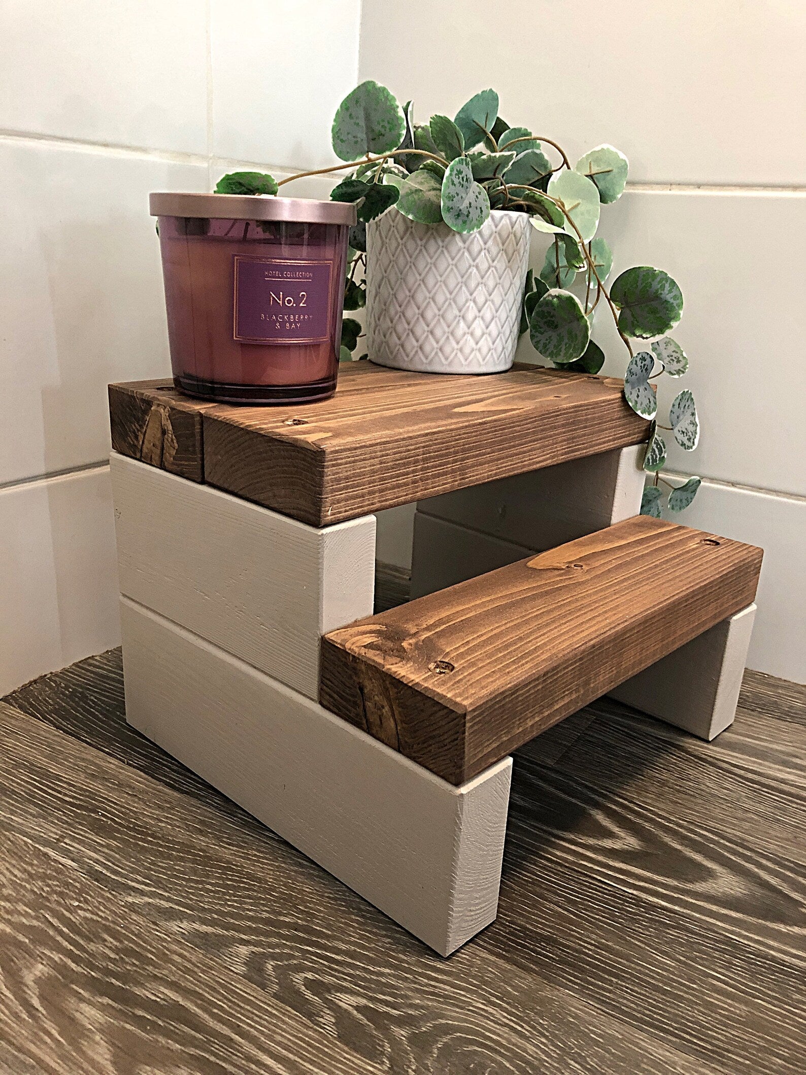 Handmade 2-tier wooden step stool, ideal for reaching high places in any room. Crafted from Scandinavian Pine with a two-tone finish. Base available in select Farrow and Ball colors. Dimensions: W: 30cm, H: 21cm, D: 26cm. Other colour options include Fresh Pine. Variations in grain and colour may occur due to the unique nature of each piece of wood