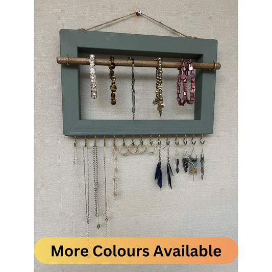 Handmade premium jewellery organizer crafted from timber, with hooks and a storage rod to safely store rings, necklaces, earrings, and bracelets. Available in 3 sizes. Frame design for wall mounting with D rings. Customizable color.