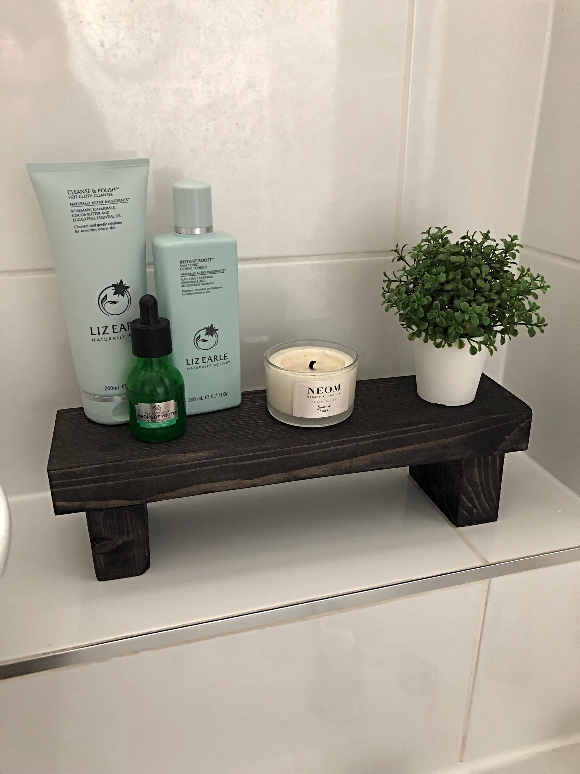 "Simple riser shelf handmade from rustic timber, perfect for any room. Ideal for windowsills, dressing tables, kitchen worktops, or bathrooms. Available in Woodland, Autumn Leaves, Fir Cone, Rustic Oak, Fresh Pine, Farmhouse Pine, Ebony. Custom sizes: Small, Medium, Large. Dimensions: Large - Length 450mm, Width 89mm, Height 99mm."