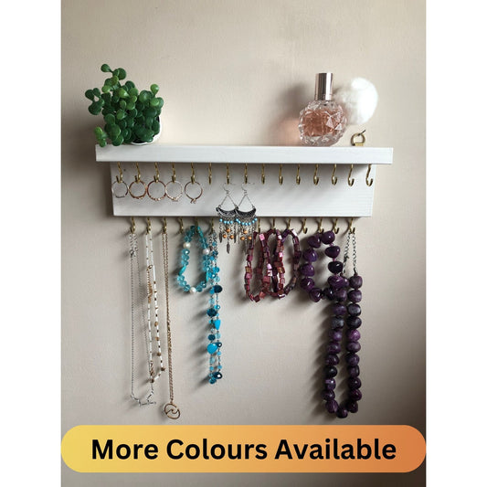 Small style shelf jewellery organiser with two rows of hooks for necklace and jewellry storage. Bottom row of hooks visible beneath the shelf, while another row is discreetly tucked underneath the top ledge. Ideal for keeping your accessories neatly organised and easily accessible.