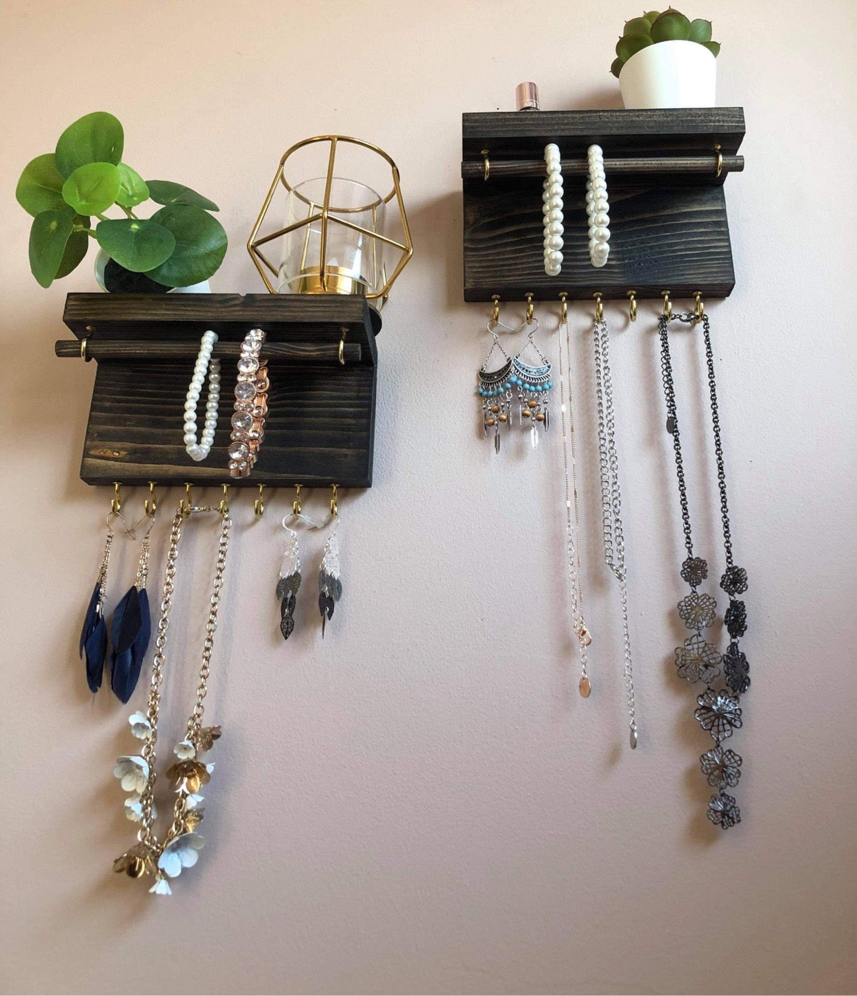 Handmade wooden jewellery organizers and earring displays in various finishes including Rustic Oak and Ebony. Each organizer features 7 brass hooks for ample storage. Perfect for showcasing necklaces, bracelets, and earrings. Customize with brass or upgrade to silver/chrome hooks and D rings