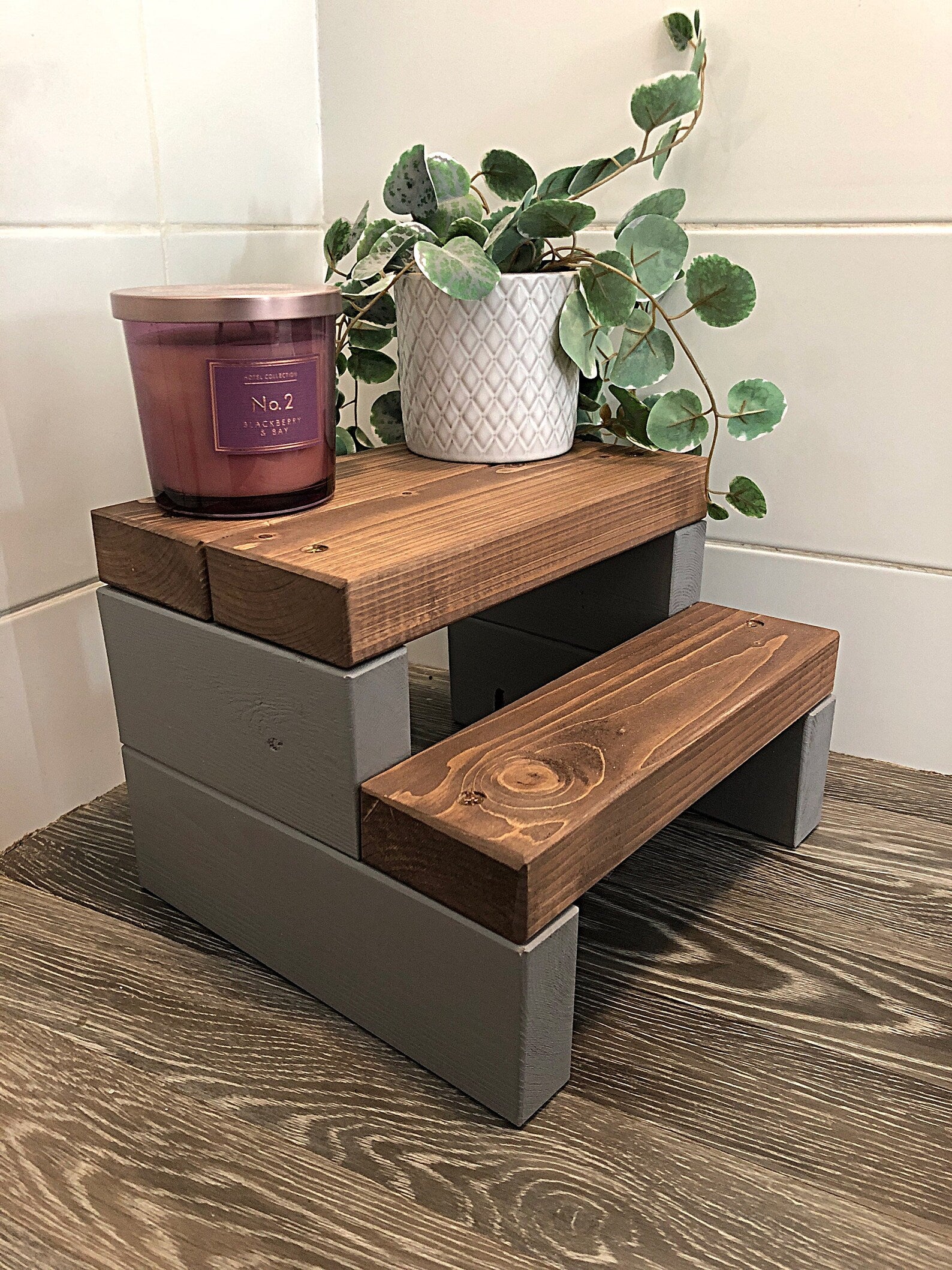Handmade 2-tier wooden step stool, ideal for reaching high places in any room. Crafted from Scandinavian Pine with a two-tone finish. Base available in select Farrow and Ball colors. Dimensions: W: 30cm, H: 21cm, D: 26cm. Other colour options include Fresh Pine. Variations in grain and colour may occur due to the unique nature of each piece of wood