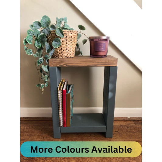 Handmade narrow side table crafted from carefully selected timber, versatile for various settings Features spacious top for plants or candles and low shelf for books or tall vase. Finished with two-tone effect: base in select Farrow and Ball colors, top in Dark Oak or Medium Oak wood dye. Dimensions: H: 44.5cm, W: 33cm, D: 14cm, with 33cm height between shelf and top. Enjoy FREE delivery on all handmade items. Order now for a carefully packaged product crafted with love. Build time: 3-4 weeks.