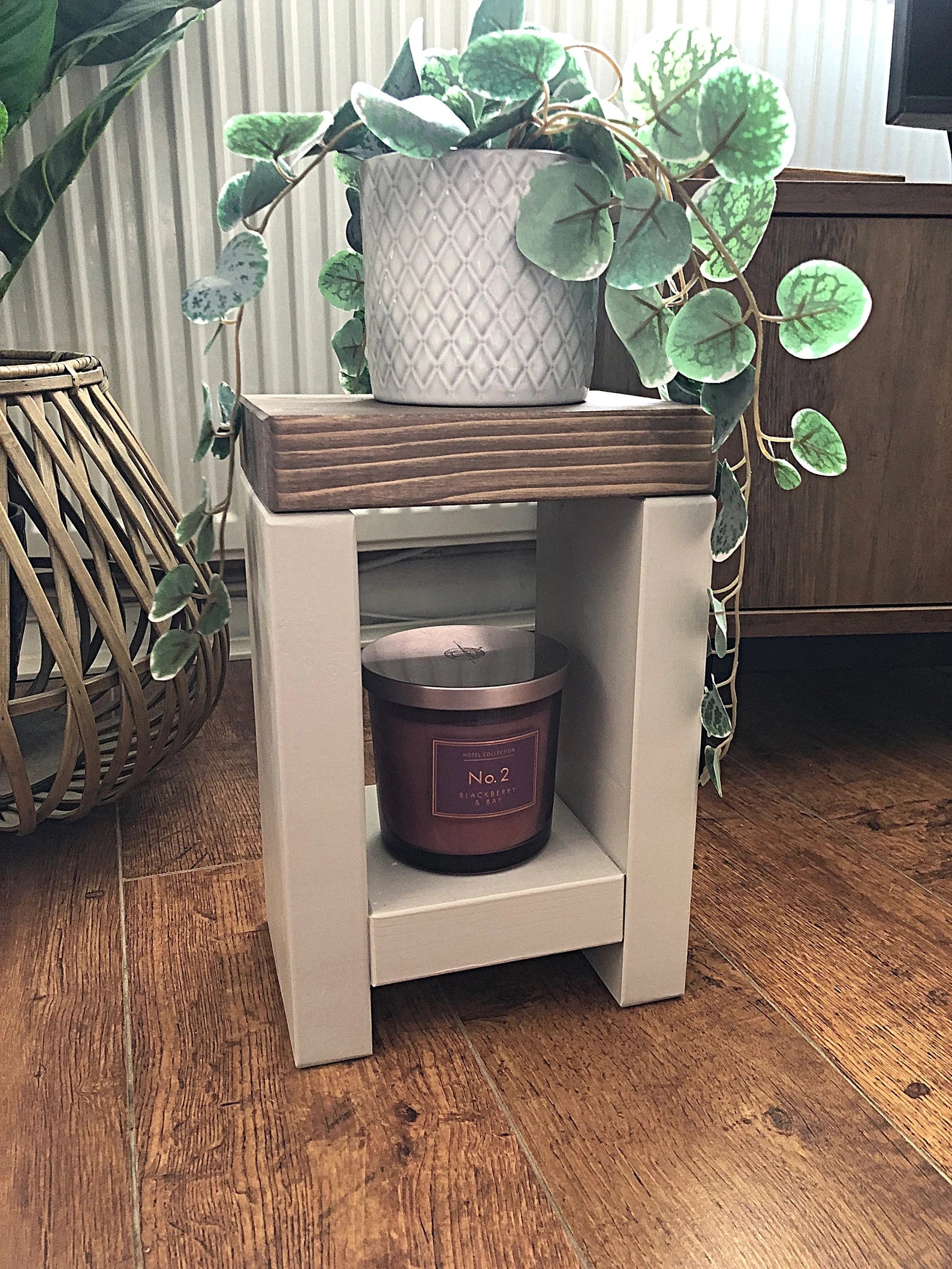 Artisan-crafted from premium timber, this small side table exudes character and elegance with its hand-applied finish in Farrow and Ball colors. Perfect for adding a bespoke touch to your decor, its carefully chosen hues enhance the table's natural beauty while seamlessly blending with any interior style. Elevate your space with this unique piece of furniture, meticulously crafted to bring warmth and sophistication to your home