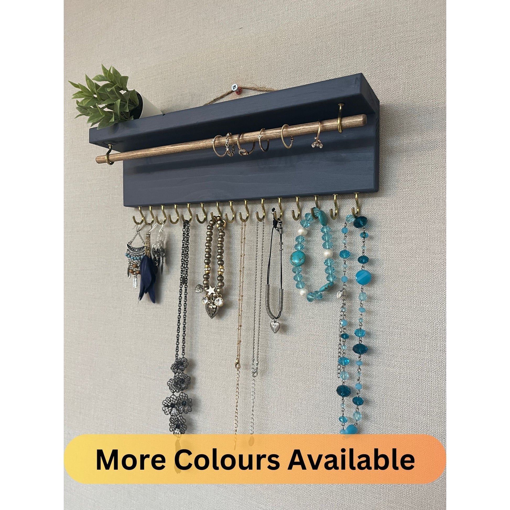 Handmade premium jewellery organizer crafted from timber, featuring 15 hooks for rings, necklaces, earrings, and bracelets. Top shelf for small items. Compact design, easy to hang, customizable color. Perfect gift for fashion lovers.