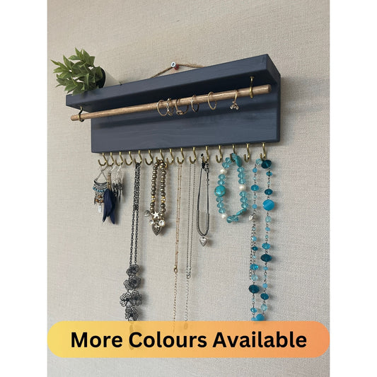 Handmade premium jewellery organizer crafted from timber, featuring 15 hooks for rings, necklaces, earrings, and bracelets. Top shelf for small items. Compact design, easy to hang, customizable color. Perfect gift for fashion lovers.