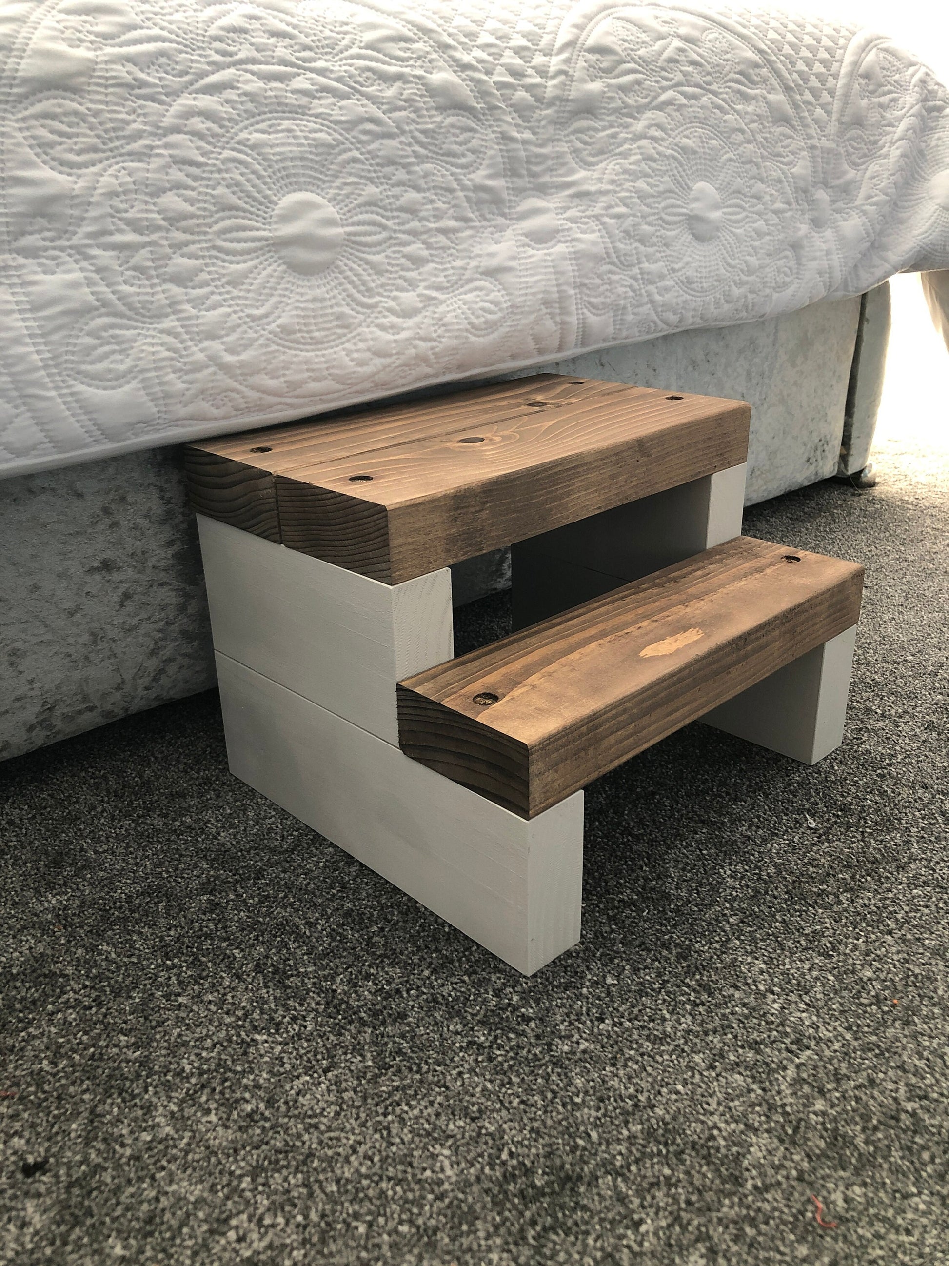 Handmade 2-tier wooden step stool, ideal for reaching high places in any room. Crafted from Scandinavian Pine with a two-tone finish. Base available in select Farrow and Ball colors. Dimensions: W: 30cm, H: 21cm, D: 26cm. Other colour options include Fresh Pine. Variations in grain and colour may occur due to the unique nature of each piece of wood