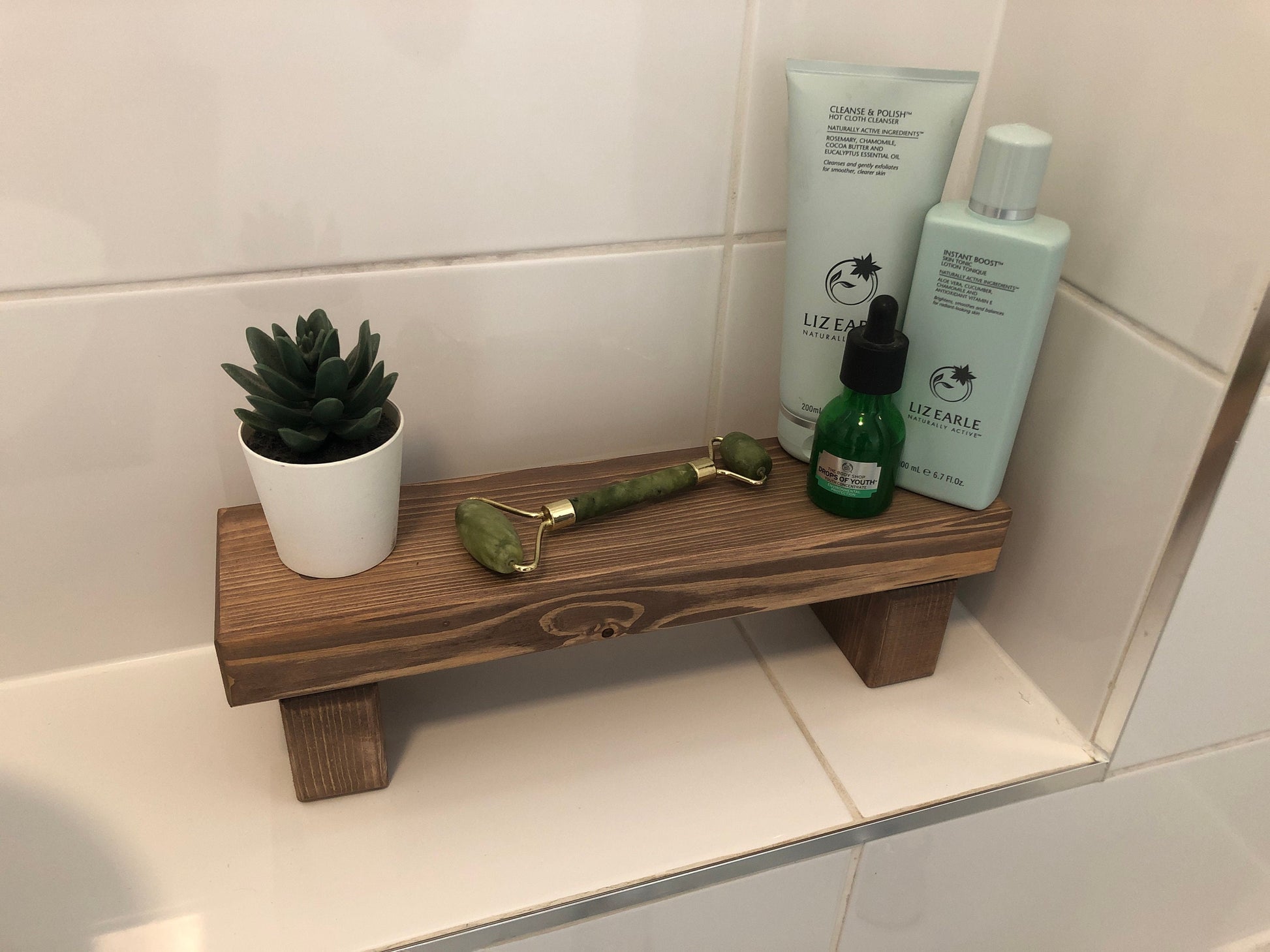 "Simple riser shelf handmade from rustic timber, perfect for any room. Ideal for windowsills, dressing tables, kitchen worktops, or bathrooms. Available in Woodland, Autumn Leaves, Fir Cone, Rustic Oak, Fresh Pine, Farmhouse Pine, Ebony. Custom sizes: Small, Medium, Large. Dimensions: Large - Length 450mm, Width 89mm, Height 99mm."