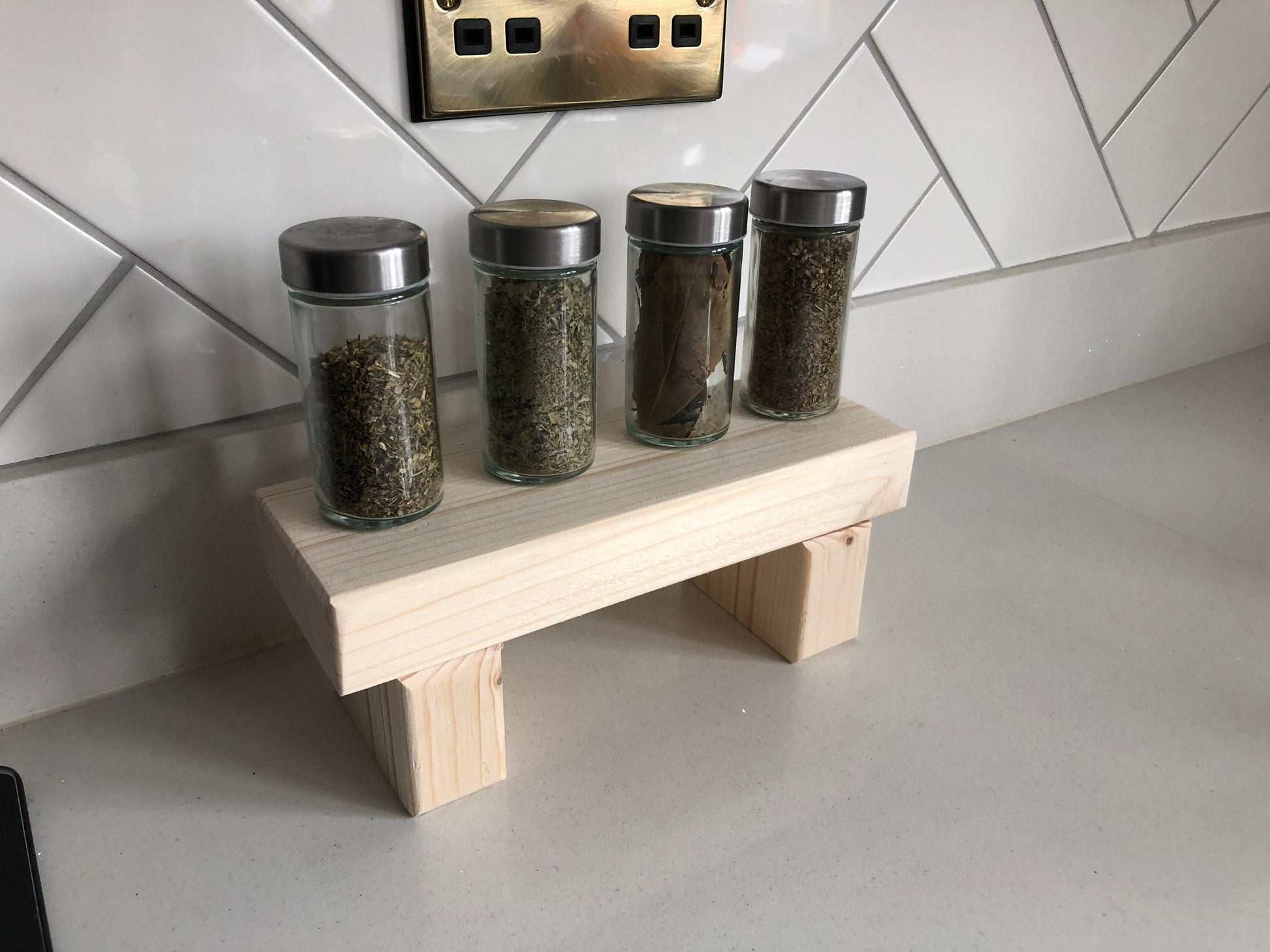 "Simple riser shelf handmade from rustic timber, perfect for any room. Ideal for windowsills, dressing tables, kitchen worktops, or bathrooms. Available in Woodland, Autumn Leaves, Fir Cone, Rustic Oak, Fresh Pine, Farmhouse Pine, Ebony. Custom sizes: Small, Medium, Large. Dimensions: Large - Length 450mm, Width 89mm, Height 99mm."